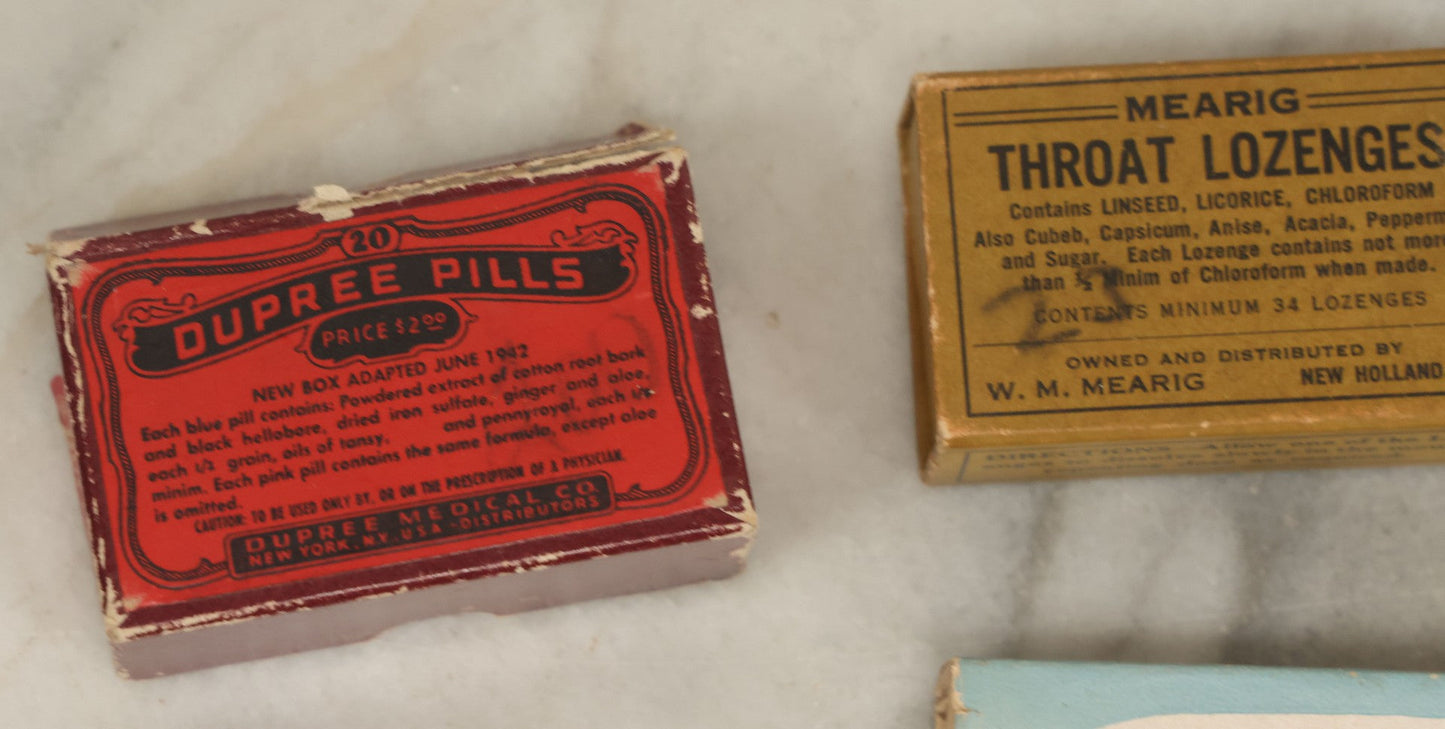 Lot 074 - Grouping Of 18 Boxed Pharmacy Items Including Ideal Syringe, Toppan's Laxative Cold Capsules, Mearig Throat Lozenges, And More