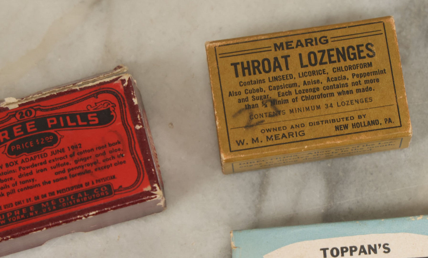 Lot 074 - Grouping Of 18 Boxed Pharmacy Items Including Ideal Syringe, Toppan's Laxative Cold Capsules, Mearig Throat Lozenges, And More