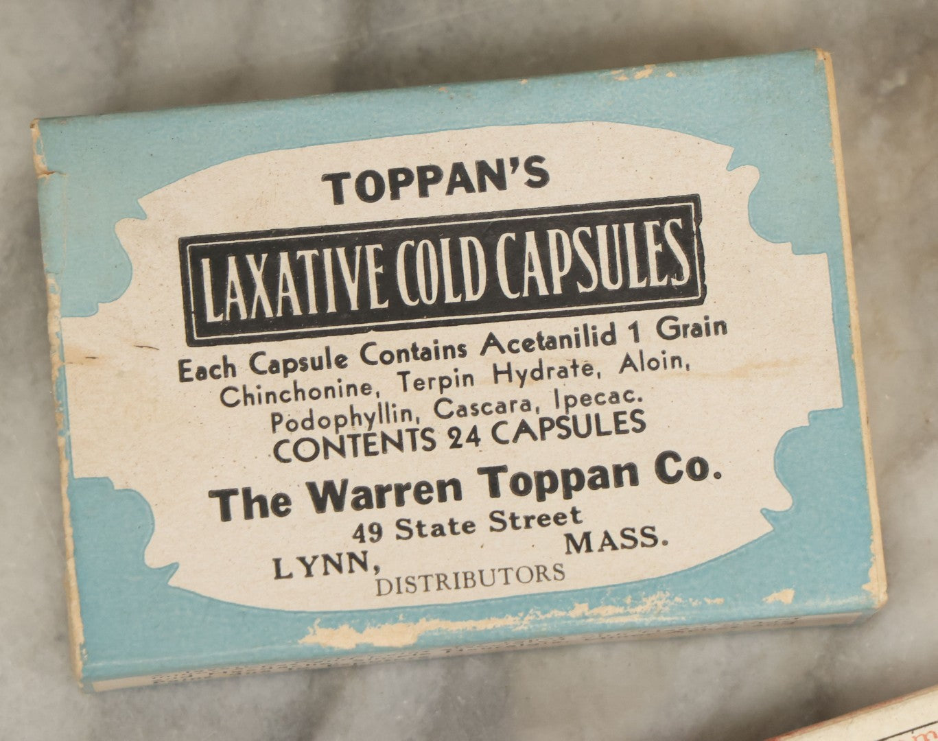 Lot 074 - Grouping Of 18 Boxed Pharmacy Items Including Ideal Syringe, Toppan's Laxative Cold Capsules, Mearig Throat Lozenges, And More