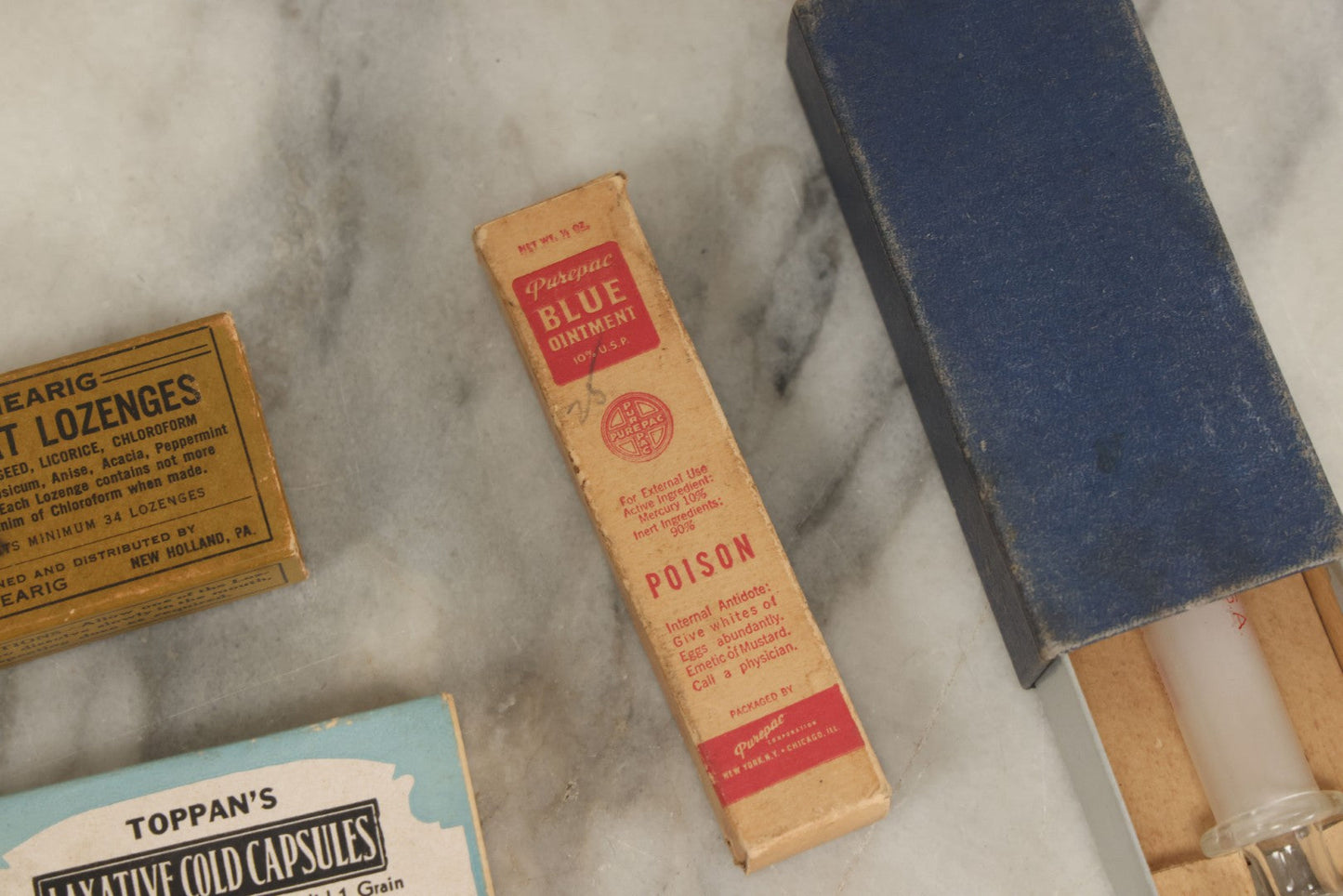 Lot 074 - Grouping Of 18 Boxed Pharmacy Items Including Ideal Syringe, Toppan's Laxative Cold Capsules, Mearig Throat Lozenges, And More