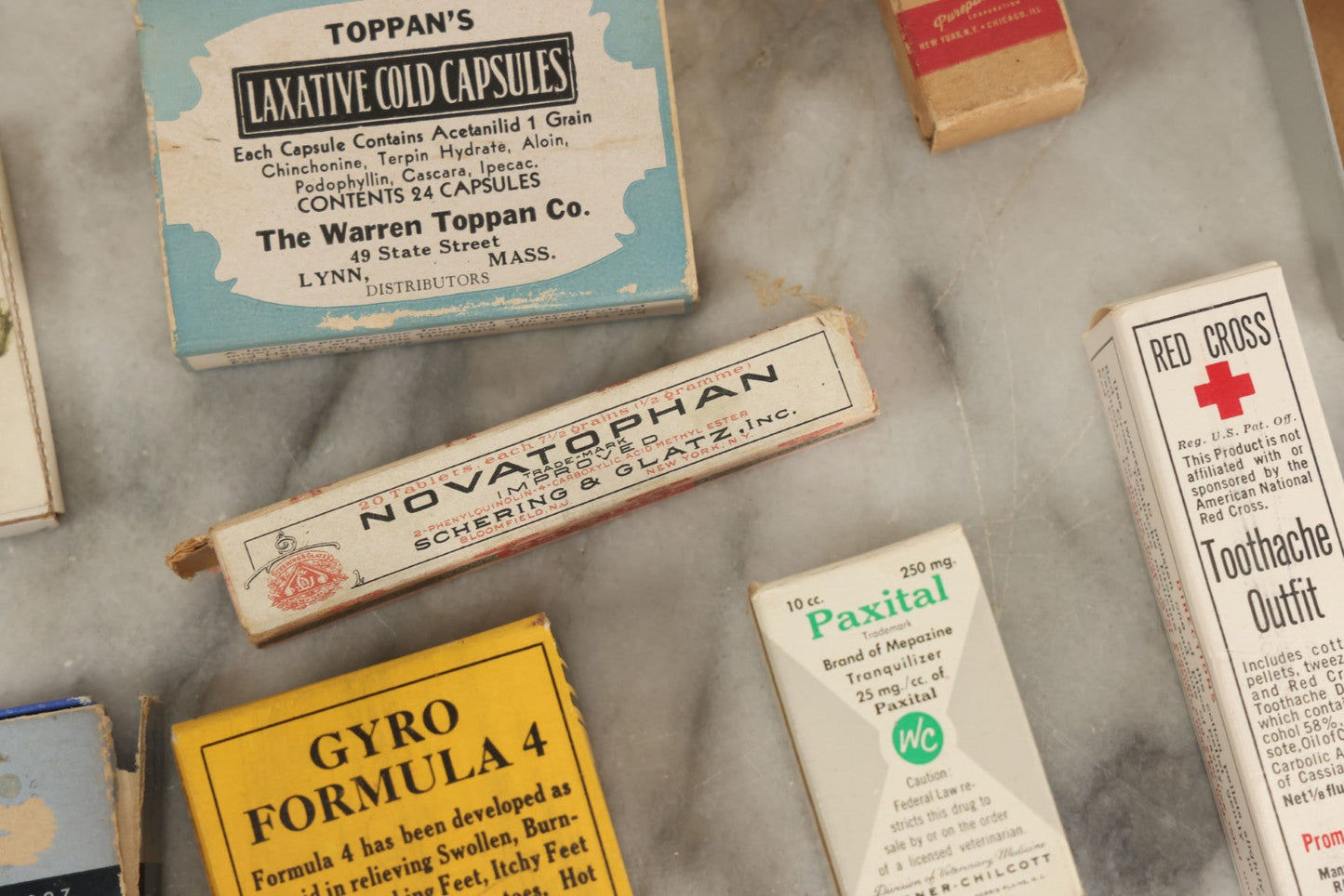 Lot 074 - Grouping Of 18 Boxed Pharmacy Items Including Ideal Syringe, Toppan's Laxative Cold Capsules, Mearig Throat Lozenges, And More