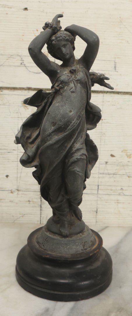 Lot 095 - Antique Spelter Statue Of Woman In Windswept Gown, Dancing, With Stars Around Spelter Base, On Wooden Pedestal