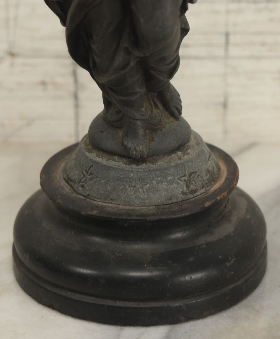 Lot 095 - Antique Spelter Statue Of Woman In Windswept Gown, Dancing, With Stars Around Spelter Base, On Wooden Pedestal