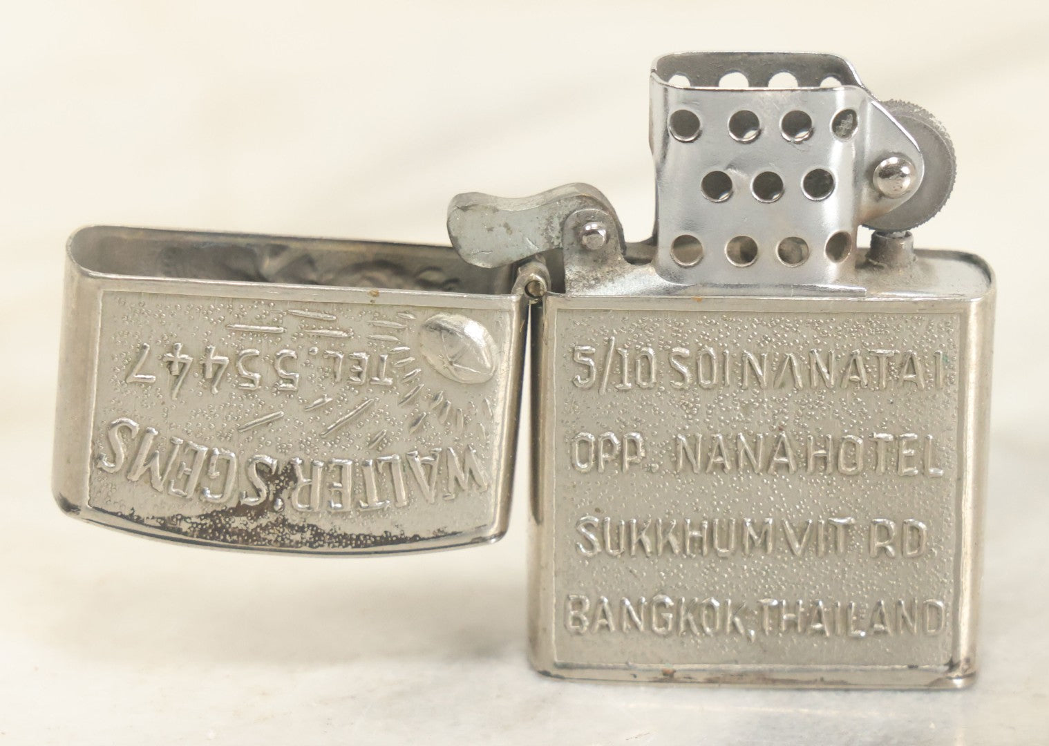 Lot 102 - Walter's Gems Advertising Lighter From Bangkok, Thailand, With Dancing Deities Motif