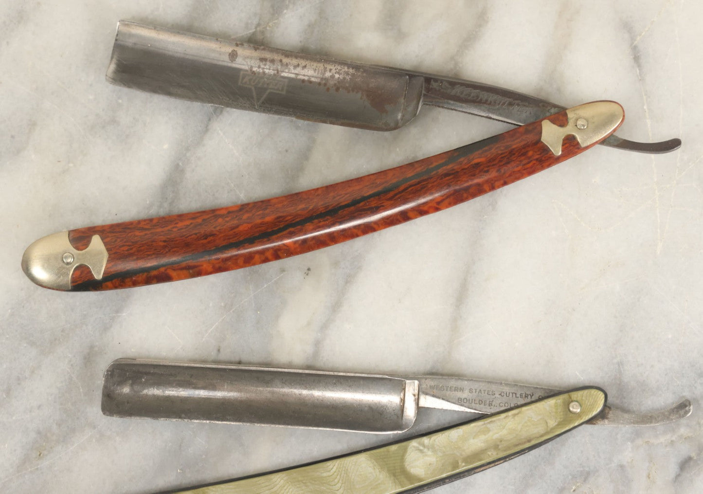 Lot 109 - Grouping Of Three Vintage Straight Shaving Razors Including Keenkutter With Wood Grain Handle, Blue Grass With Black Handle, And Western States Cutlery Co. With Green Handle