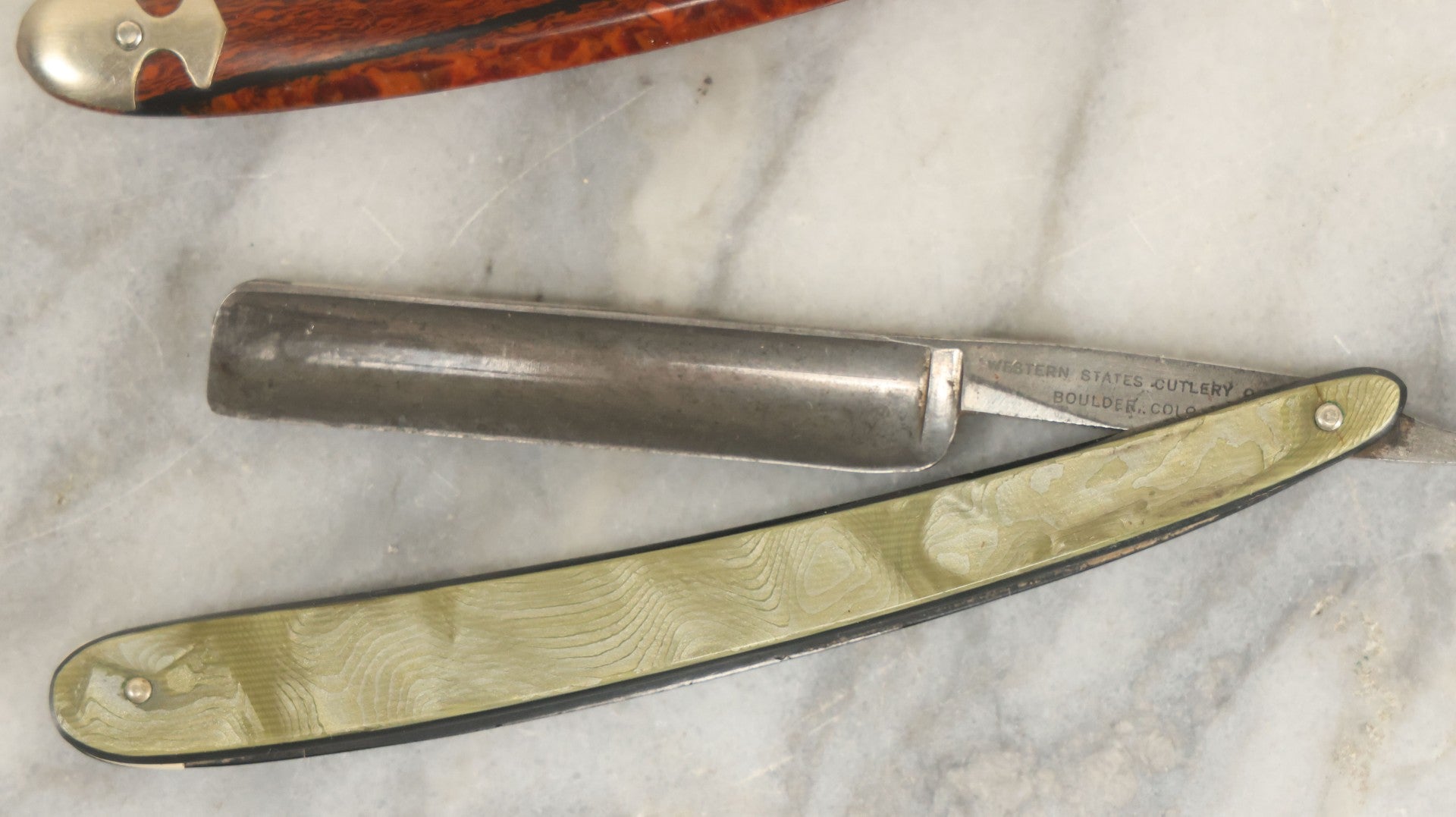 Lot 109 - Grouping Of Three Vintage Straight Shaving Razors Including Keenkutter With Wood Grain Handle, Blue Grass With Black Handle, And Western States Cutlery Co. With Green Handle