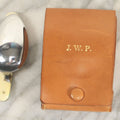 Lot 111 - Vintage Leather Travel Pouch With Three Pieces Of Folding Cutlery, J.P. Monogram