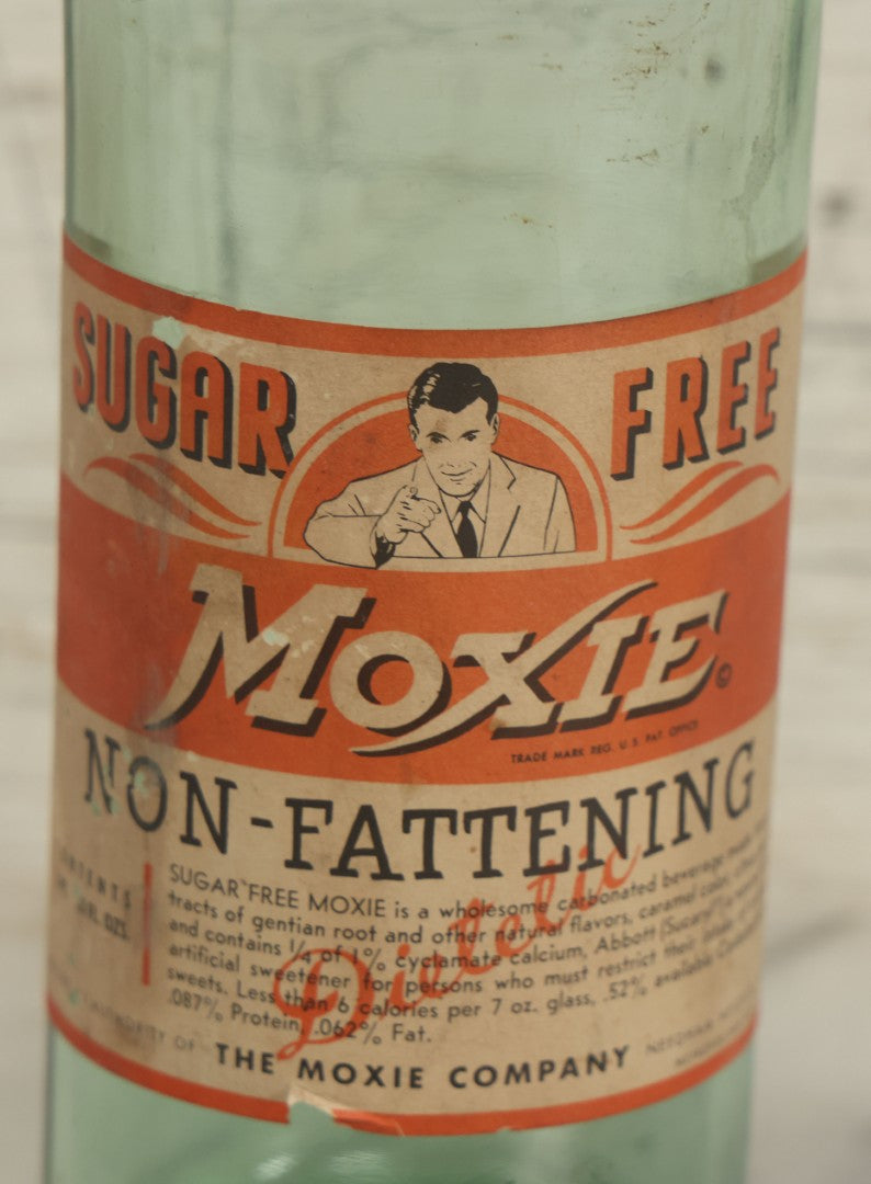 Lot 129 - Vintage Sugar Free Moxie Non-Fattening Dietic Tonic Soda Bottle With Original Paper Label, Bottled By The Moxie Company, Needham Heights, Massachusetts