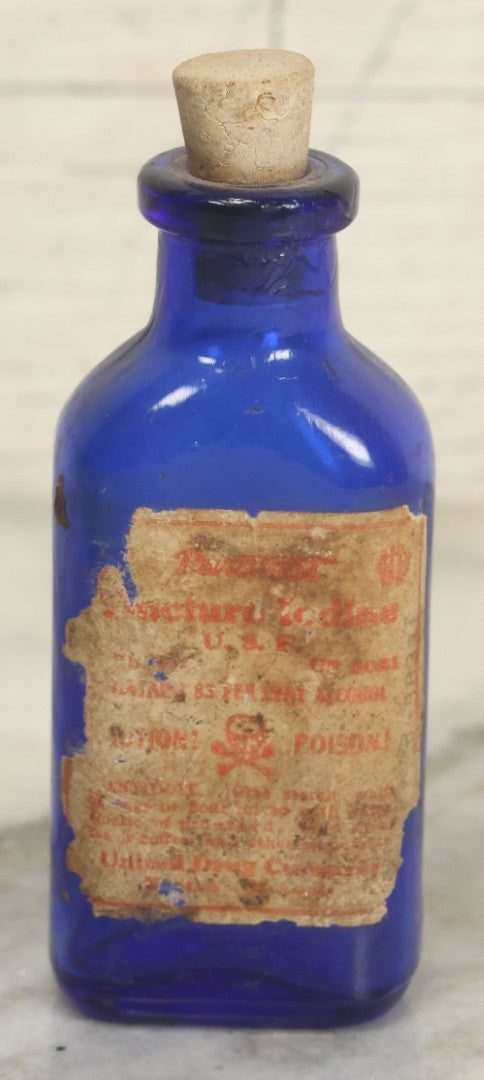 Lot 005 - Pair Of Antique Cobalt Blue Glass Pharmacy Bottles, Including Poison Bottle With Partial Paper Label, And Camphoric Acid Bottle