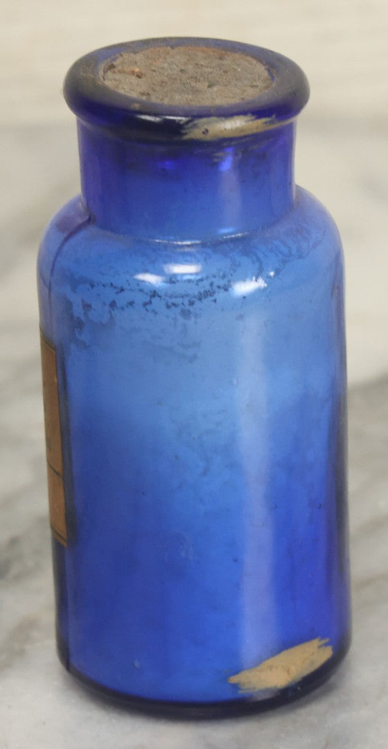 Lot 005 - Pair Of Antique Cobalt Blue Glass Pharmacy Bottles, Including Poison Bottle With Partial Paper Label, And Camphoric Acid Bottle