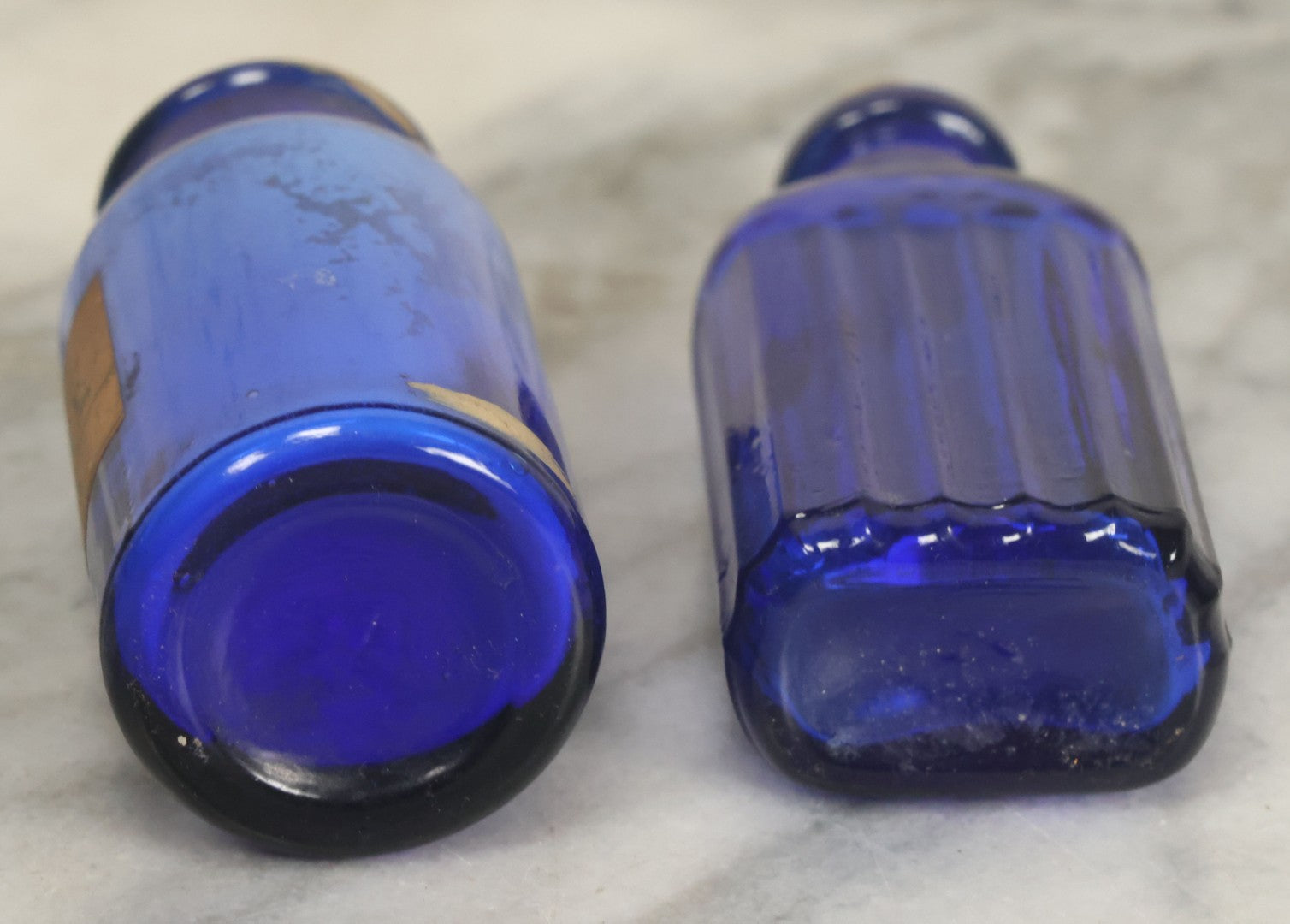 Lot 005 - Pair Of Antique Cobalt Blue Glass Pharmacy Bottles, Including Poison Bottle With Partial Paper Label, And Camphoric Acid Bottle