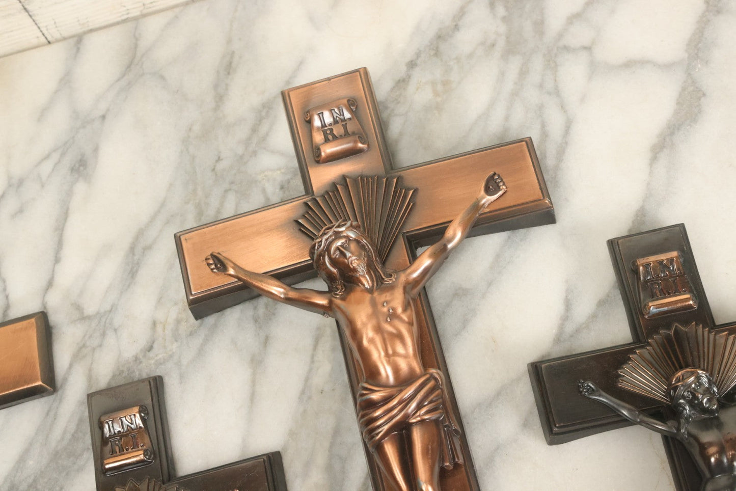 Lot 008 - Grouping Of Four Vintage Metal Funeral Casket Crucifixes Including Three With Jesus And One Without