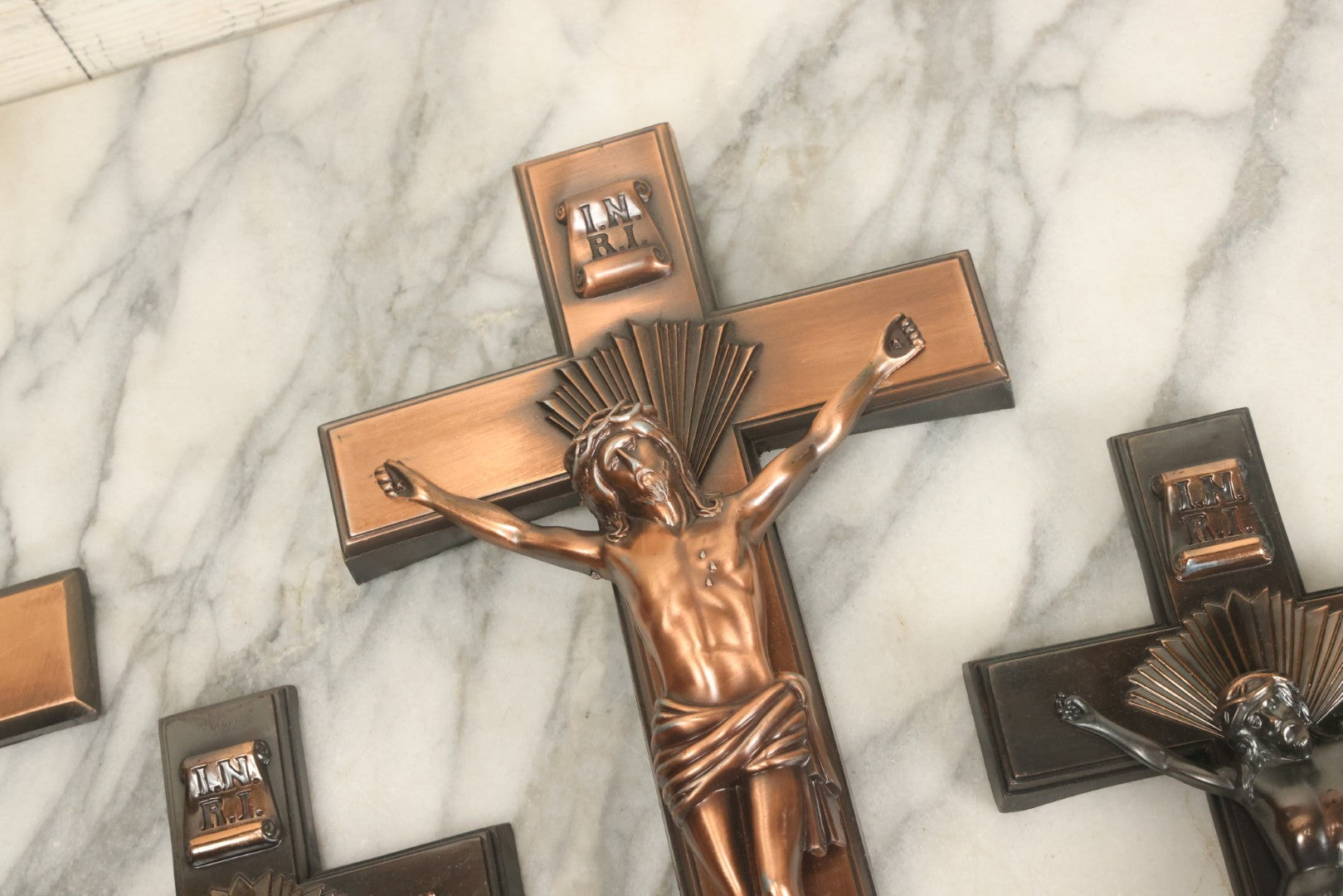 Lot 008 - Grouping Of Four Vintage Metal Funeral Casket Crucifixes Including Three With Jesus And One Without