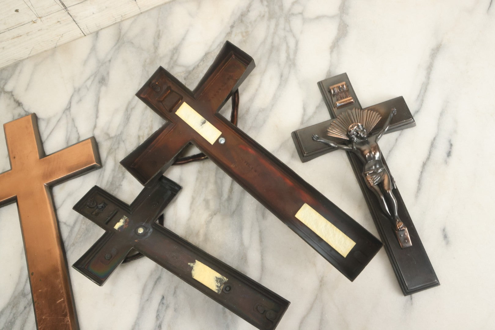 Lot 008 - Grouping Of Four Vintage Metal Funeral Casket Crucifixes Including Three With Jesus And One Without