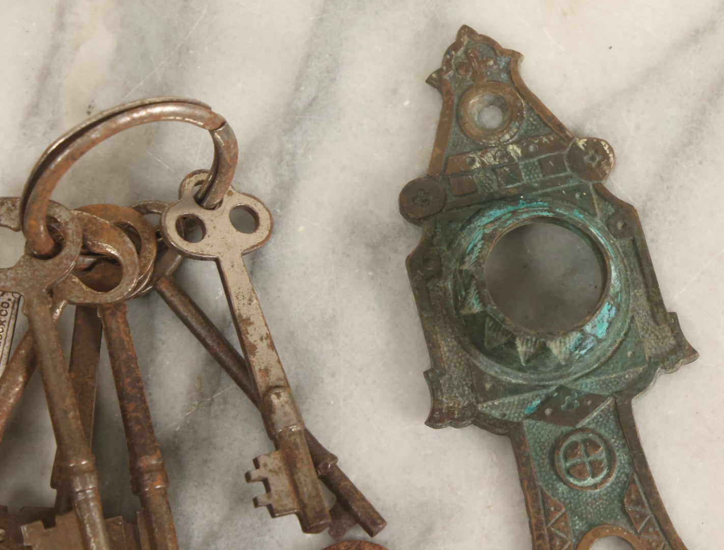 Lot 021 - Grouping Of Ten Antique Skeleton Keys And Two Ornate Antique Doorknob Mount Escutcheons, As Found