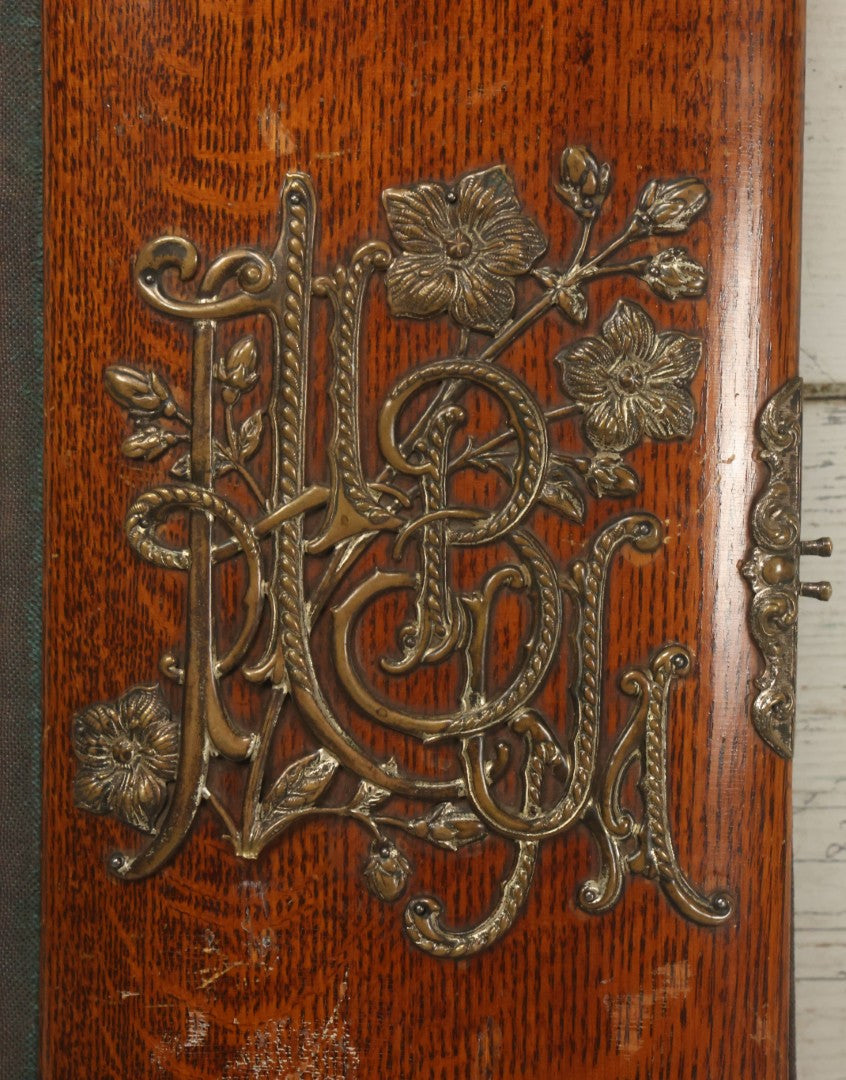 Lot 034 - Antique Victorian Cabinet Card Photo Album With Thirteen Cabinet Card Photographs And Laquered Wooden Cover With Metal Album Adornment And Green Fabric Back, Note Latch Missing