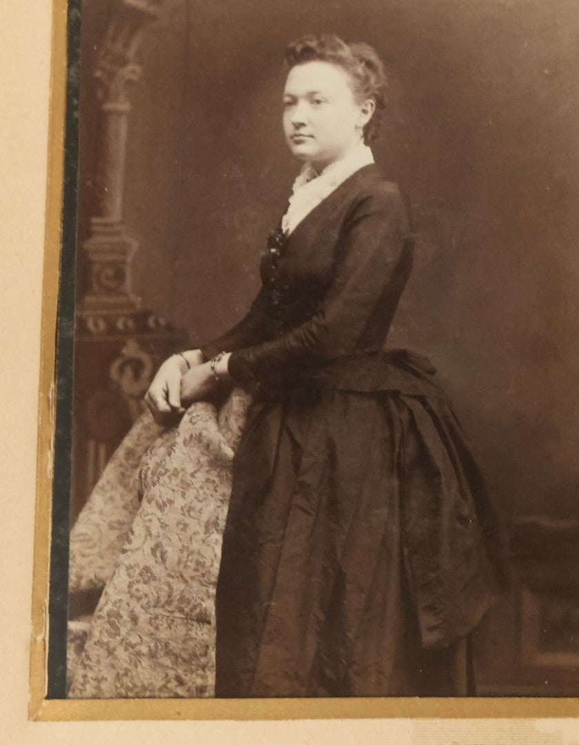 Lot 034 - Antique Victorian Cabinet Card Photo Album With Thirteen Cabinet Card Photographs And Laquered Wooden Cover With Metal Album Adornment And Green Fabric Back, Note Latch Missing