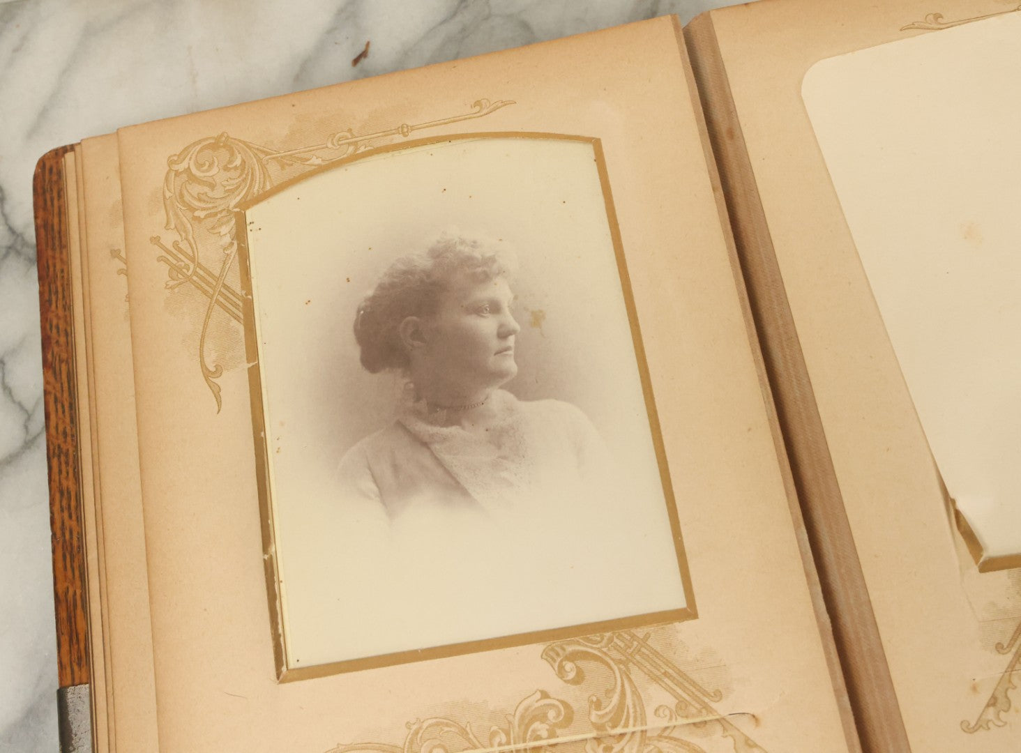 Lot 034 - Antique Victorian Cabinet Card Photo Album With Thirteen Cabinet Card Photographs And Laquered Wooden Cover With Metal Album Adornment And Green Fabric Back, Note Latch Missing