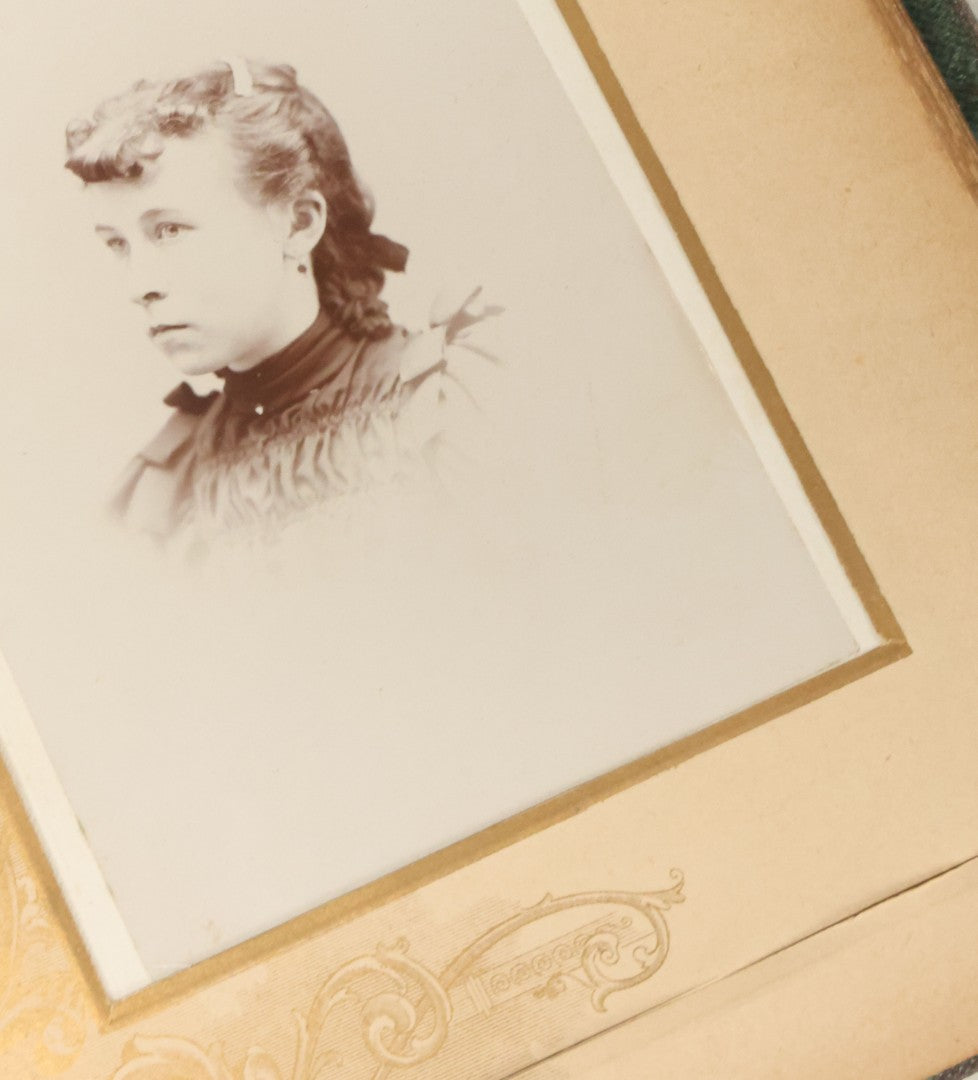 Lot 034 - Antique Victorian Cabinet Card Photo Album With Thirteen Cabinet Card Photographs And Laquered Wooden Cover With Metal Album Adornment And Green Fabric Back, Note Latch Missing