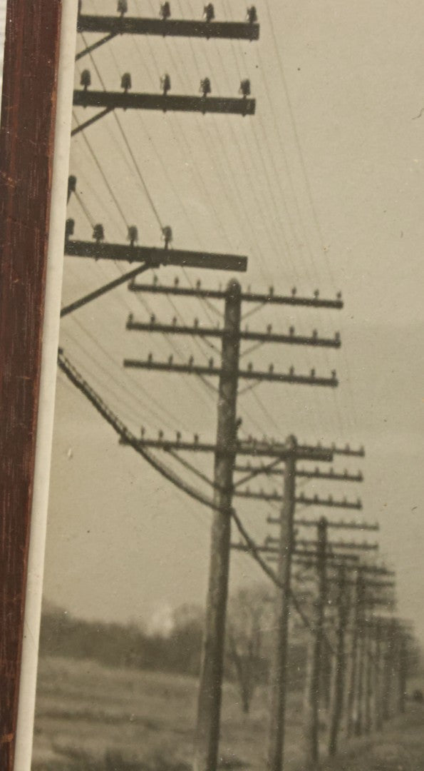 Lot 035 - Vintage Framed Glossy Photograph Of A Railroad Locomotive Train Alongside Power Lines, Circa 1920, In Frame