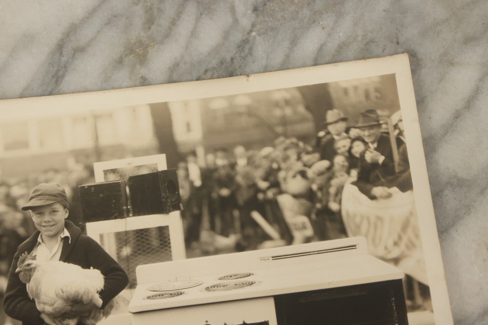 Lot 038 - Vintage Large Format Photograph Of Smiling Child Holding A Chicken At A Country Fair Beside An Oven