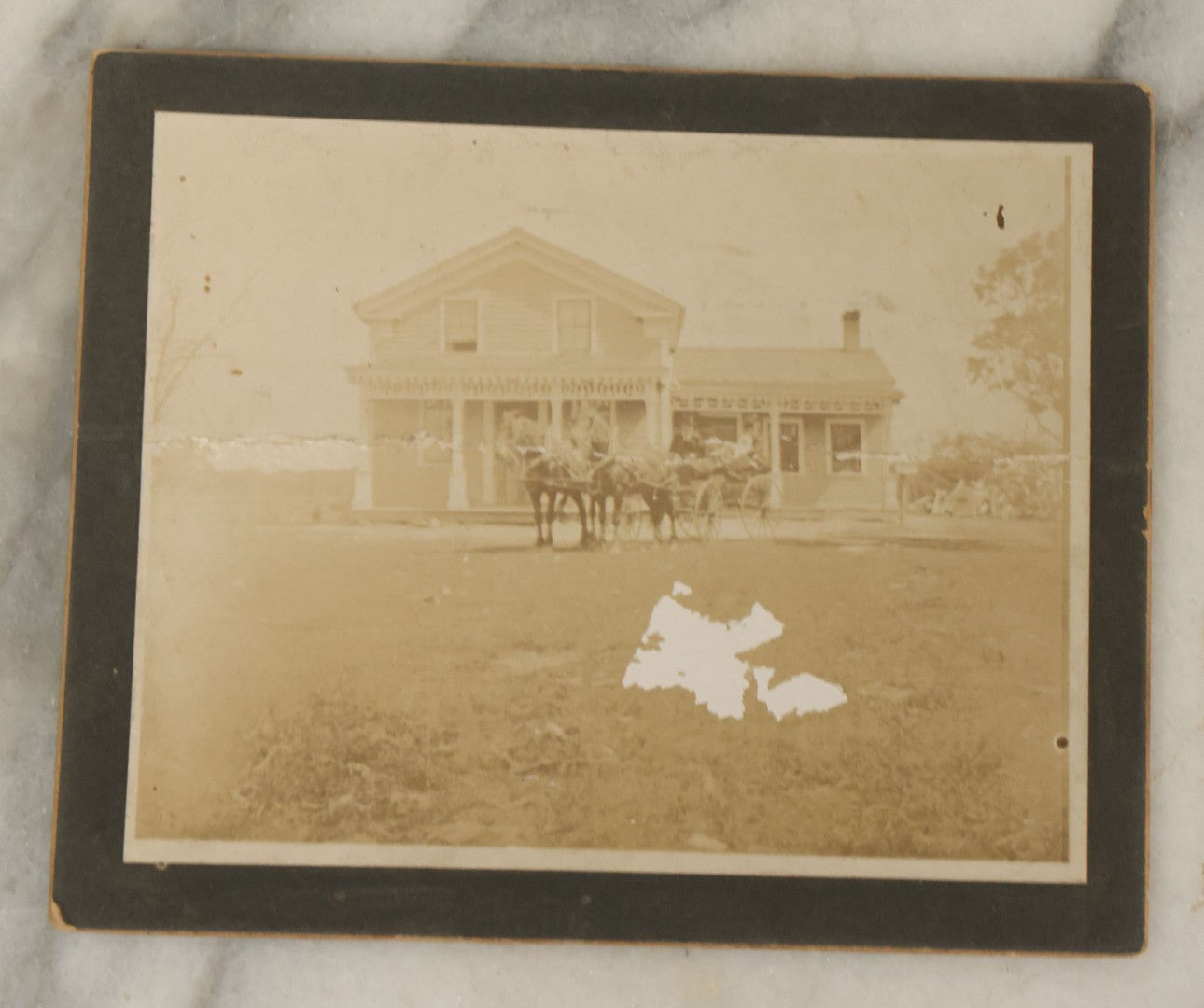 Lot 044 - Grouping Of Five Antique Boarded Photographs Including Worker Posing With Machinery, Exterior Of House, Women Standing By Tree, Horse-Drawn Carriage, And Baby