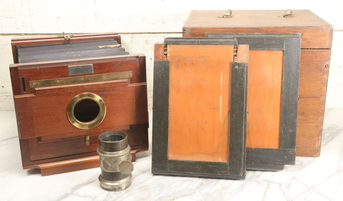 Lot 001 - Antique Wooden Camera By American Optical Company, Scovill Manufacturing Company, Proprietors, With New York, With Lens (Does Not Fit Camera) And Case From M.B. Loughman Photographic Apparatus, Boston - See Condition Notes