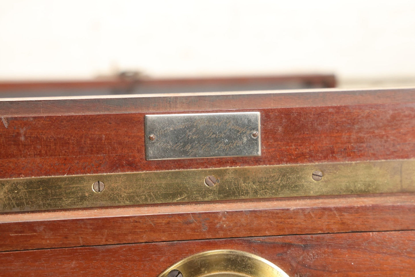 Lot 001 - Antique Wooden Camera By American Optical Company, Scovill Manufacturing Company, Proprietors, With New York, With Lens (Does Not Fit Camera) And Case From M.B. Loughman Photographic Apparatus, Boston - See Condition Notes
