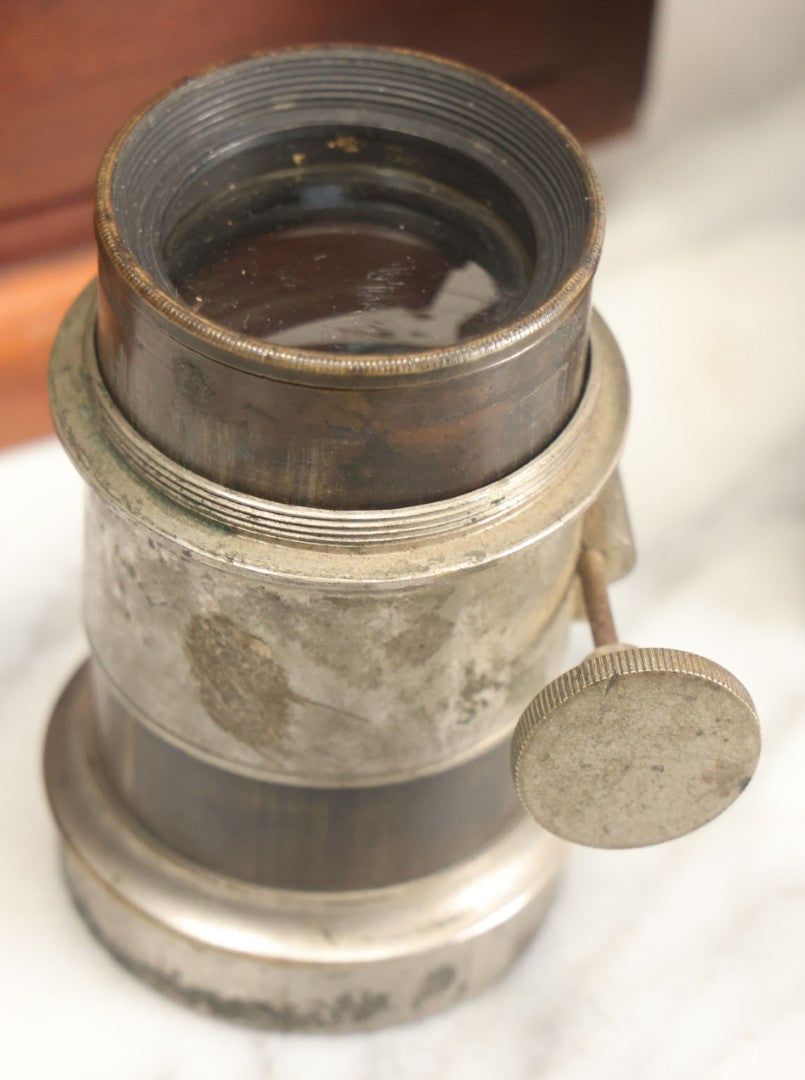 Lot 001 - Antique Wooden Camera By American Optical Company, Scovill Manufacturing Company, Proprietors, With New York, With Lens (Does Not Fit Camera) And Case From M.B. Loughman Photographic Apparatus, Boston - See Condition Notes