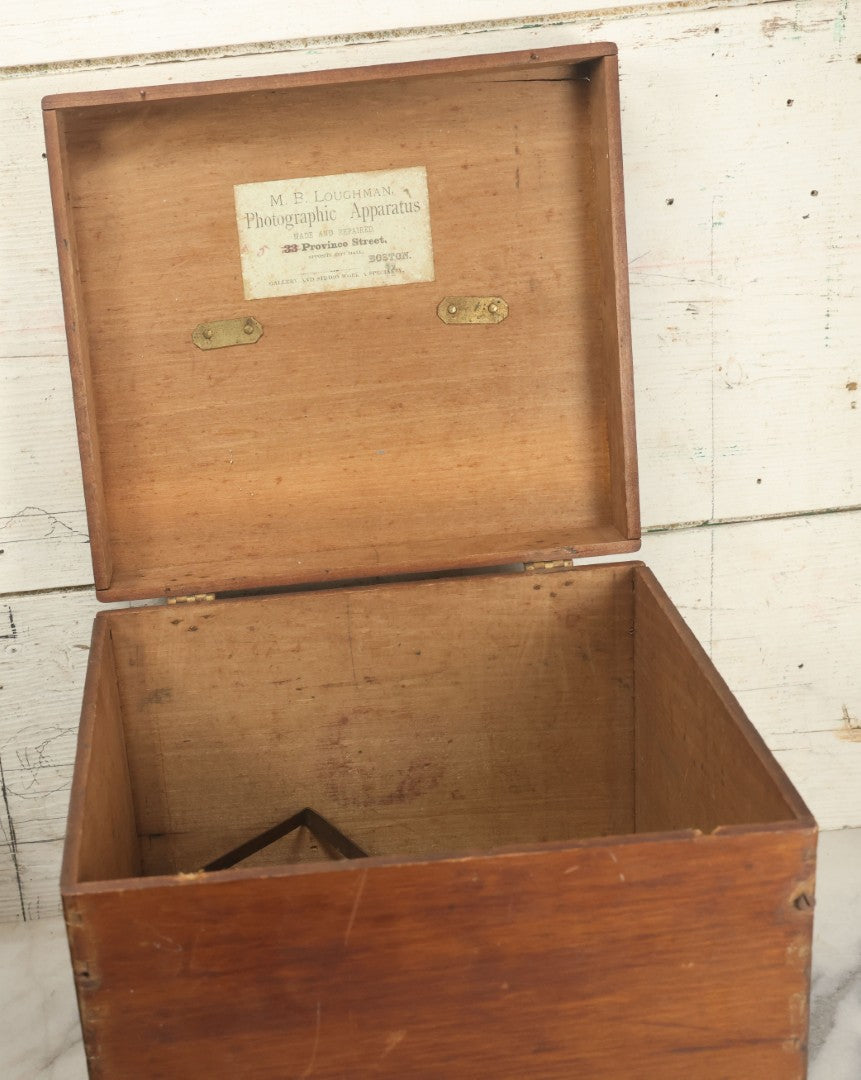Lot 001 - Antique Wooden Camera By American Optical Company, Scovill Manufacturing Company, Proprietors, With New York, With Lens (Does Not Fit Camera) And Case From M.B. Loughman Photographic Apparatus, Boston - See Condition Notes