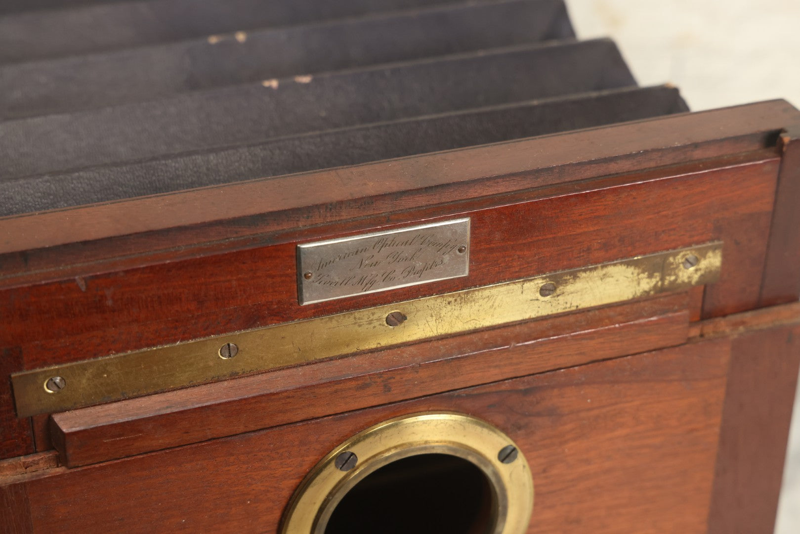 Lot 001 - Antique Wooden Camera By American Optical Company, Scovill Manufacturing Company, Proprietors, With New York, With Lens (Does Not Fit Camera) And Case From M.B. Loughman Photographic Apparatus, Boston - See Condition Notes