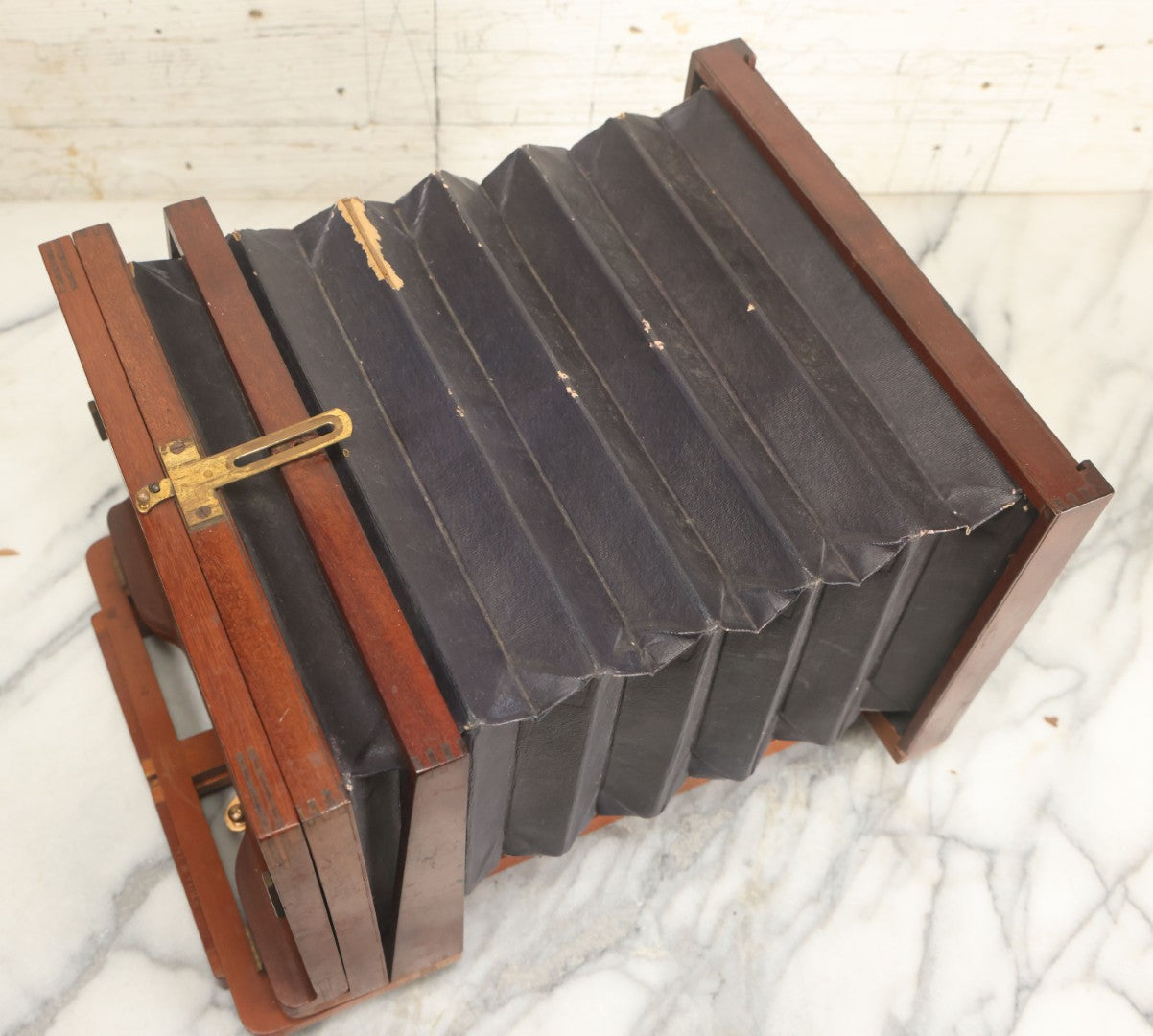 Lot 001 - Antique Wooden Camera By American Optical Company, Scovill Manufacturing Company, Proprietors, With New York, With Lens (Does Not Fit Camera) And Case From M.B. Loughman Photographic Apparatus, Boston - See Condition Notes