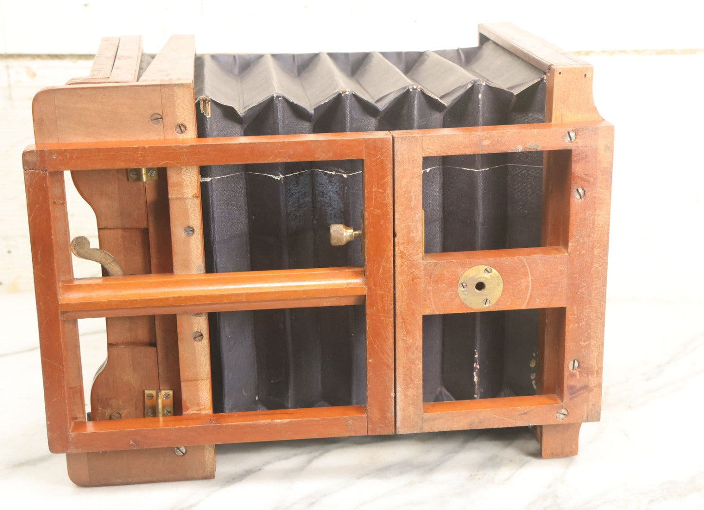 Lot 001 - Antique Wooden Camera By American Optical Company, Scovill Manufacturing Company, Proprietors, With New York, With Lens (Does Not Fit Camera) And Case From M.B. Loughman Photographic Apparatus, Boston - See Condition Notes