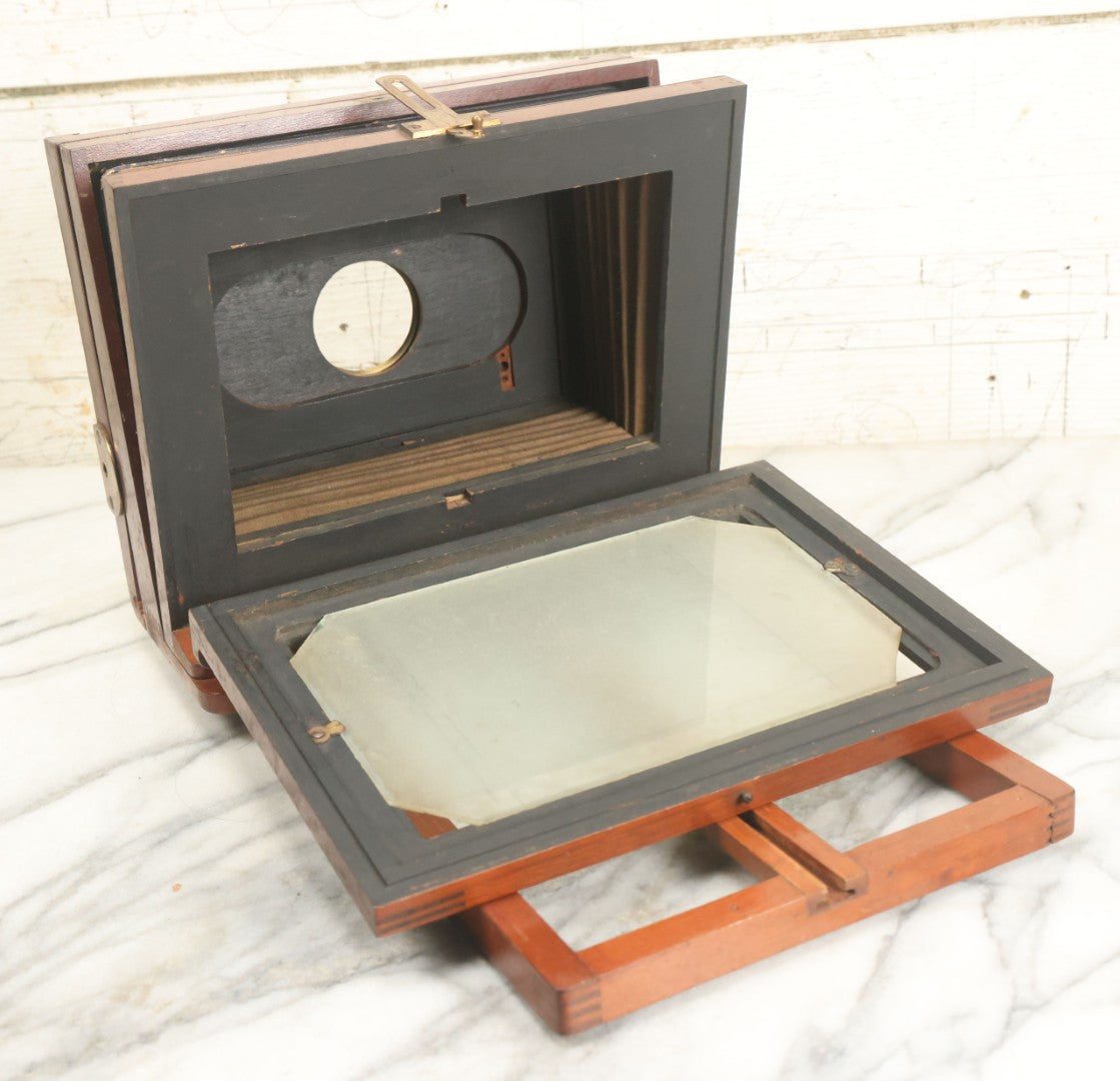 Lot 001 - Antique Wooden Camera By American Optical Company, Scovill Manufacturing Company, Proprietors, With New York, With Lens (Does Not Fit Camera) And Case From M.B. Loughman Photographic Apparatus, Boston - See Condition Notes