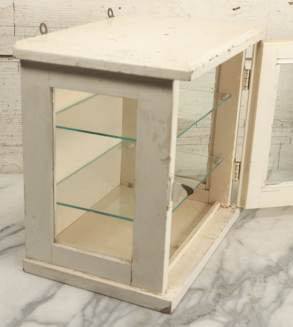 Lot 003 - Antique Wooden Barber Shop Antiseptic Sterilizer Cabinet With Glass Sides, Two Glass Shelves, And White Paint, Some Chipping To Shelves, Overall Dimensions Of Cabinet 13"L x 8-1/2"W x 12"H
