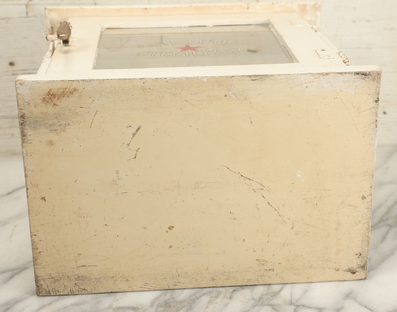 Lot 003 - Antique Wooden Barber Shop Antiseptic Sterilizer Cabinet With Glass Sides, Two Glass Shelves, And White Paint, Some Chipping To Shelves, Overall Dimensions Of Cabinet 13"L x 8-1/2"W x 12"H