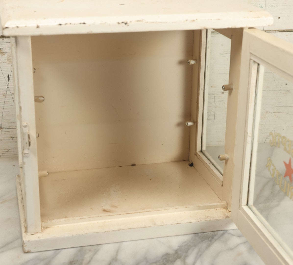 Lot 003 - Antique Wooden Barber Shop Antiseptic Sterilizer Cabinet With Glass Sides, Two Glass Shelves, And White Paint, Some Chipping To Shelves, Overall Dimensions Of Cabinet 13"L x 8-1/2"W x 12"H