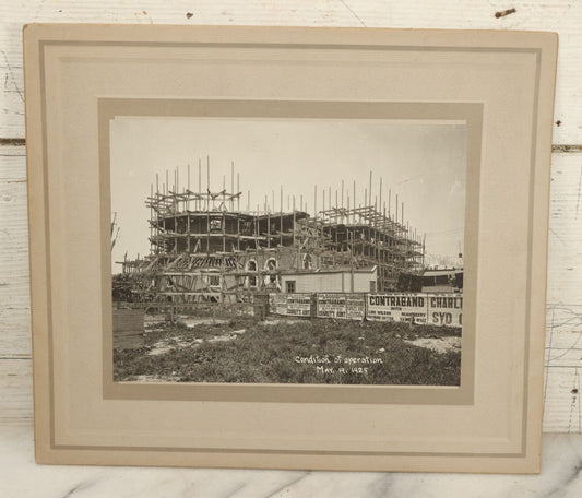 Lot 100 - Single Antique Boarded Photo Depicting A Building Under Construction, Possibly A Church In Queens, New York, With Posters Advertising The Fox Ridgewood Theater, Photo Marked "Condition Of Operations, May 19, 1925"