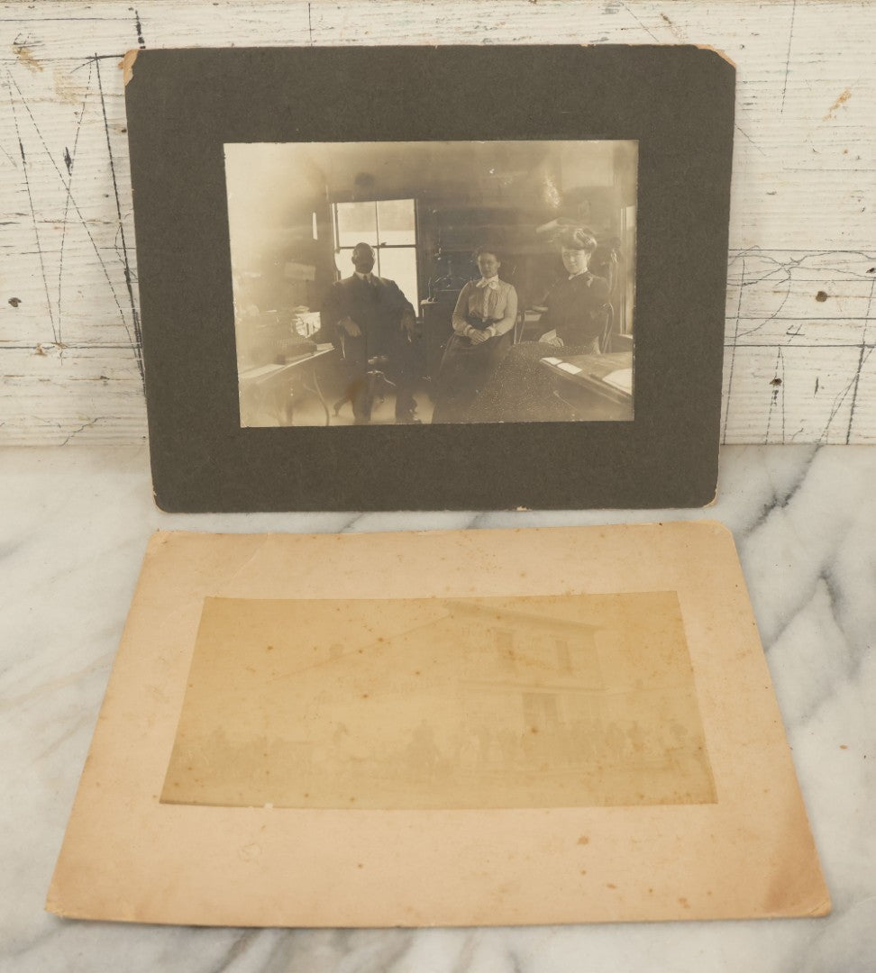 Lot 102 - Pair Of Antique Boarded Occupational Photographs Including Man And Two Women In Office With Book Press, Typewriter, And Faded Photo Of People Posing Outside Of General Store