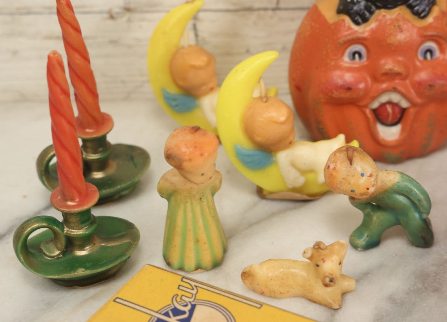 Lot 114 - Grouping Of 10+ Vintage Holiday Candles Including Santa Claus, Carolers, Modern Pumpkin Candle, Others