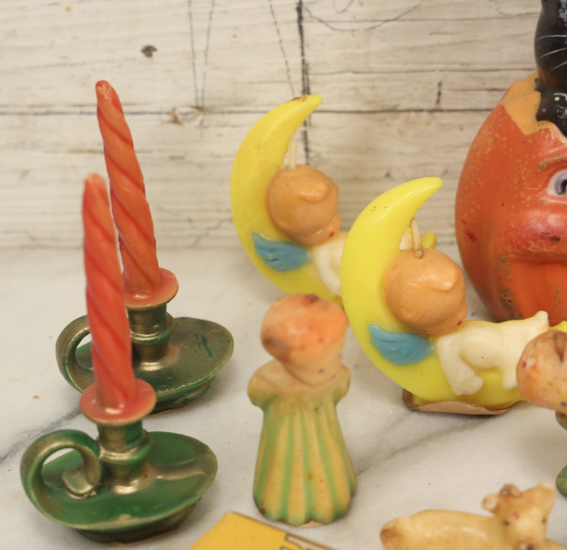 Lot 114 - Grouping Of 10+ Vintage Holiday Candles Including Santa Claus, Carolers, Modern Pumpkin Candle, Others