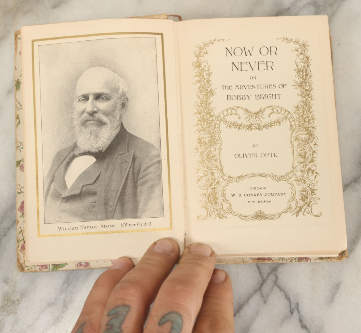 Lot 135 - "Now Or Never, Or The Adventures Of Bobby Bright" Antique Book By Oliver Optic, With Art Nouveau Cover, W.B. Conkey Company, Publishers, Chicago, 1900