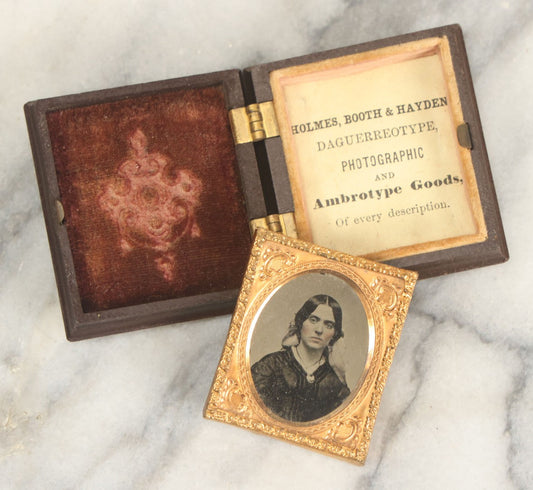 Lot 014 - Antique 1/16th Plate Ruby Ambrotype Photograph Of A Pretty Young Woman With A Long Ribbon In Her Hair In A Pictorial Thermoplastic Case Manufactured By Hoolmes, Booth, & Haydens' Daguerreotype, Photographic, And Ambrotype Goods