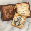 Lot 015 - Antique 1/16th Plate Ambrotype Photograph Of A Man With A 1000 Yard Stare A Comically Wide White Bowtie In A Thermoplastic Case, Genuine Union Case, Improved, Manufactured By S. Peck & Co.