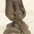 Lot 023 - Antique Figural Sheet Music Or Letter Holder With Cherub Playing Flute Motif, Cast Spelter / Brass