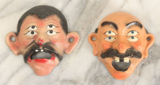 Lot 049 - Pair Of Modern Reproduction Cast Iron Four Eyed Character Bottle Openers