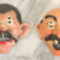 Lot 049 - Pair Of Modern Reproduction Cast Iron Four Eyed Character Bottle Openers