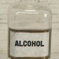 Lot 066 - Antique Whitall And Tatum Co. Glass Alcohol Apothecary Bottle Jar With Reverse Painted Glass Label, Note Chip To Lip Of Bottle, Crack In Label, 7" Height