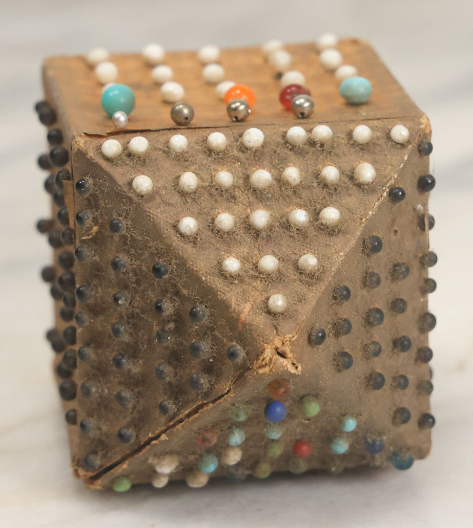 Lot 087 - Pair Of Antique Paper Board Pin Cubes, Including H.F. Neuss "Original Pin Cube" With Paper Label On Bottom, With Various Ball Head Sewing Pins 