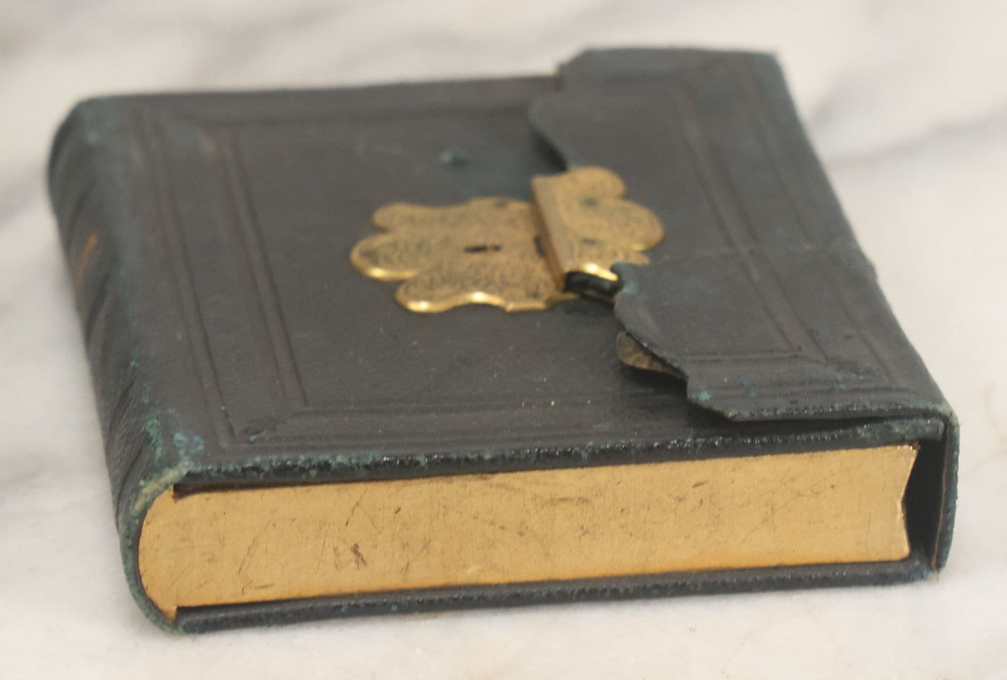 Lot 115 - Antique 1/6th Plate Daguerreotype Photograph Of Young Woman Wearing Black Lace Gloves And Large Brooch In Leatherette Folder Case With Latch, "Bijou" Lettering On Spine, Identified As Anna Matilda Blackledge, Note Partial Tear On Case Cover
